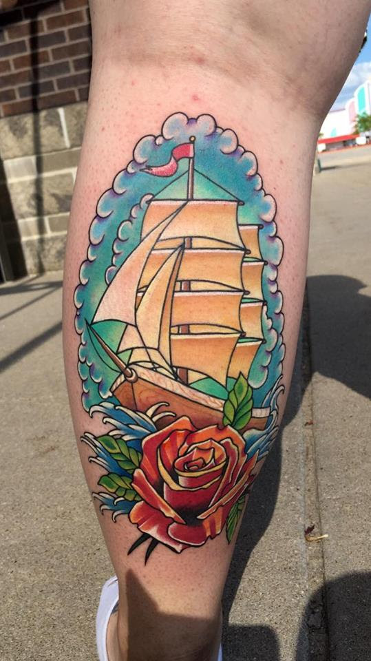 Traditional ship and rose tattoo by Tyler of Neon Dragon in Cedar Rapids, Iowa